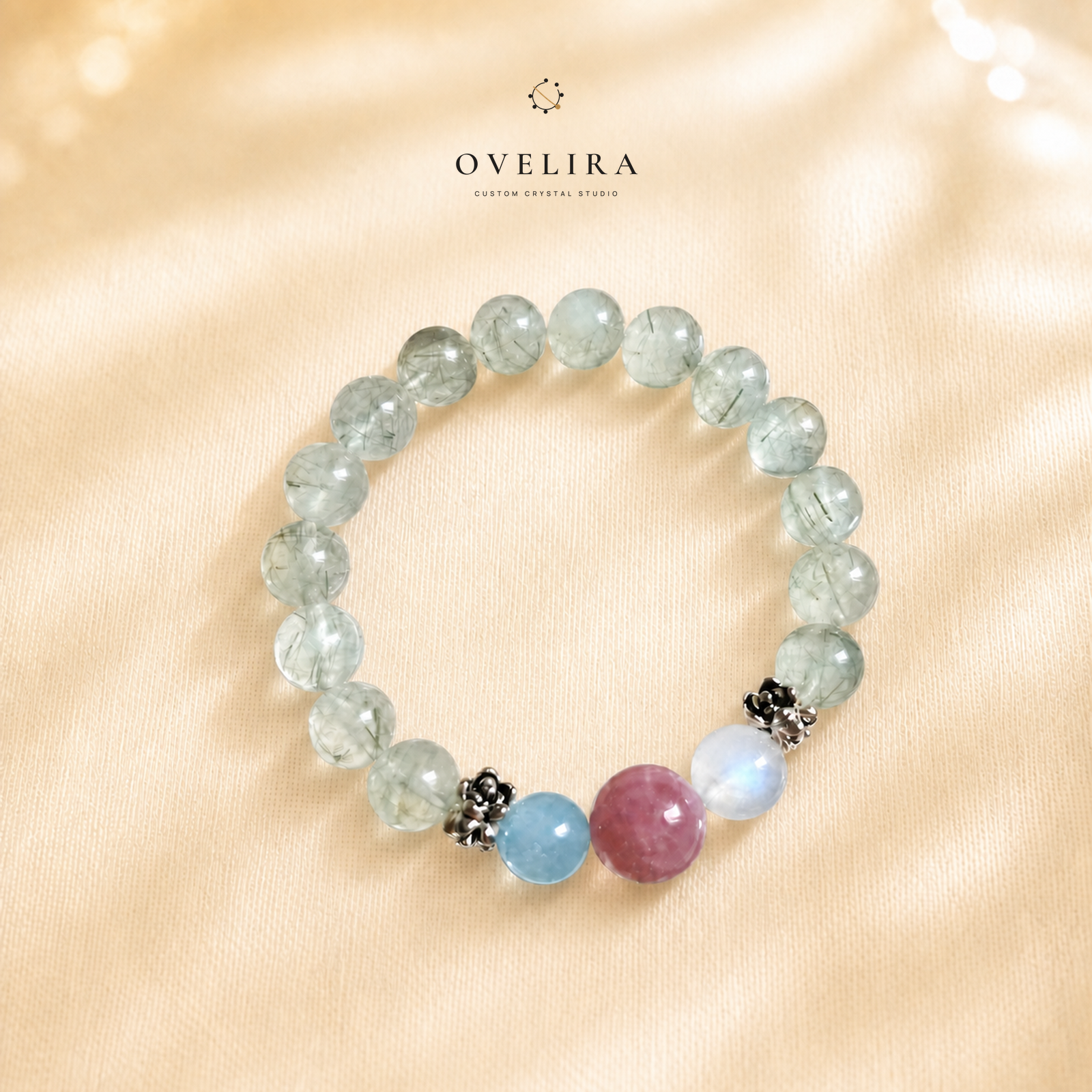 Moonlit Grove crystal bracelet on a warm ivory OVELIRA background