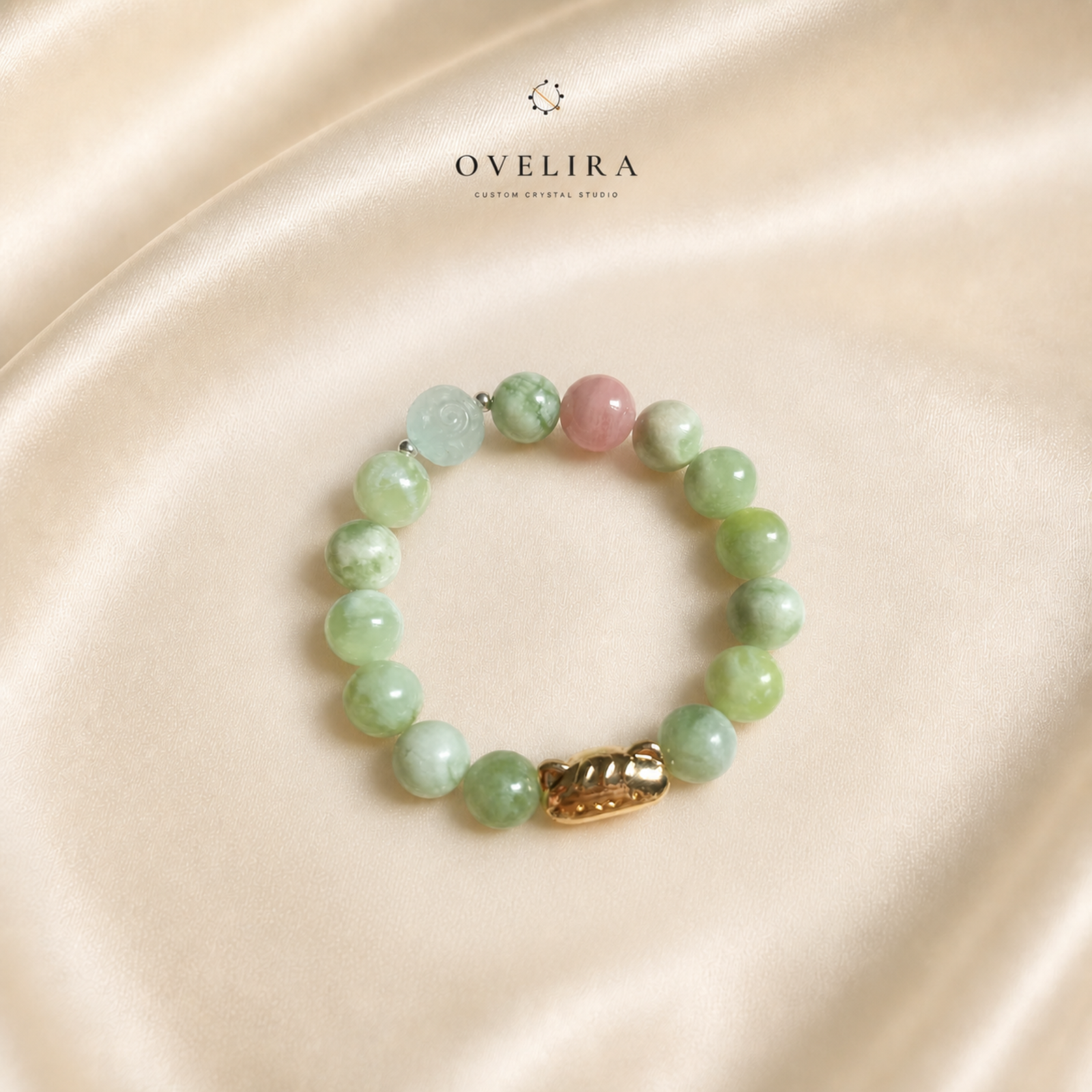 Mosslight Companion green jade and rose quartz bracelet on a warm ivory OVELIRA background