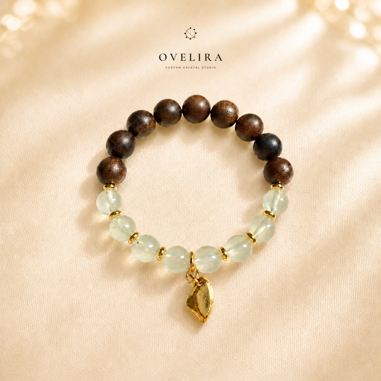 Quiet Grove agarwood and prehnite bracelet on a warm ivory OVELIRA background