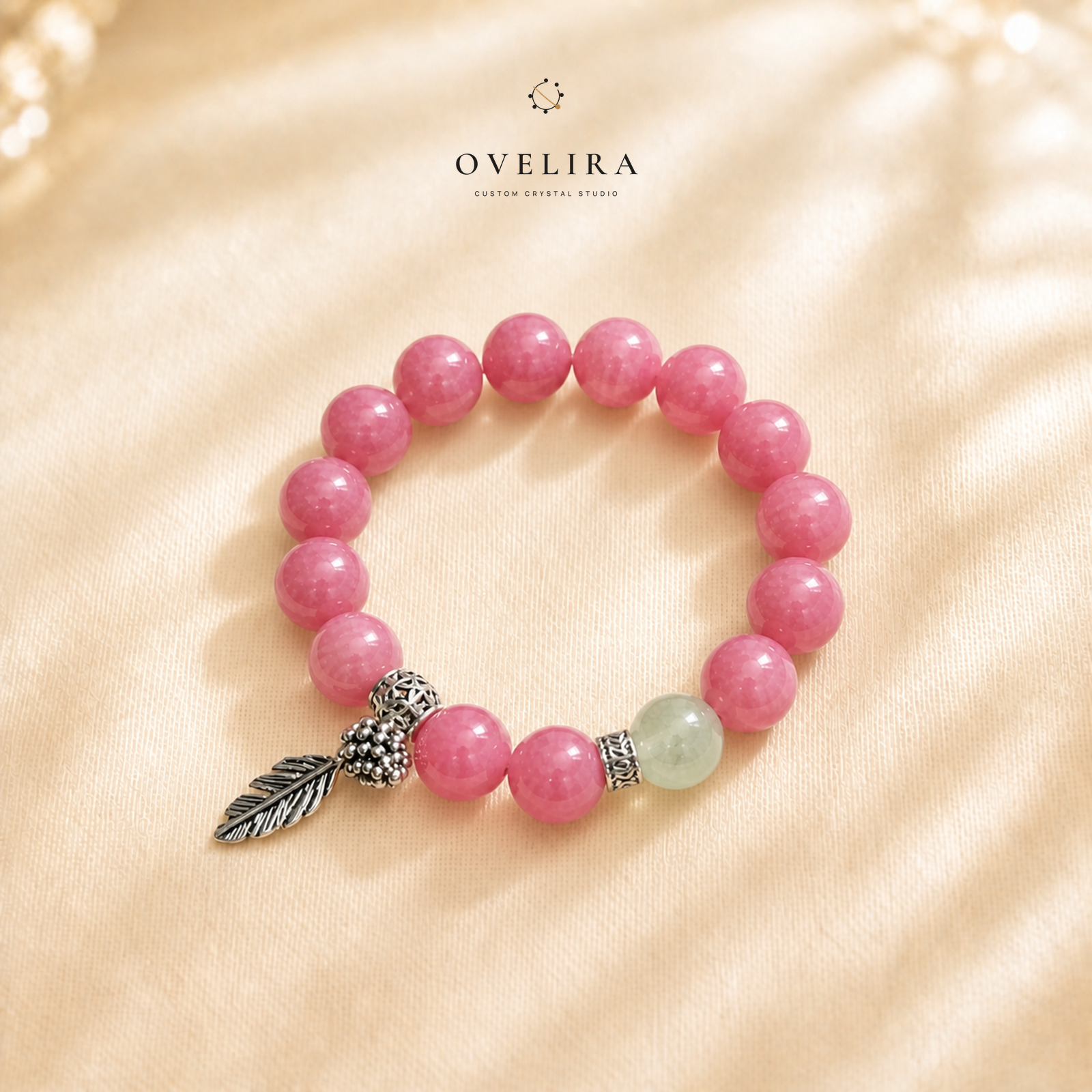 Rosevine Keepsake rose quartz bracelet on a warm ivory OVELIRA background