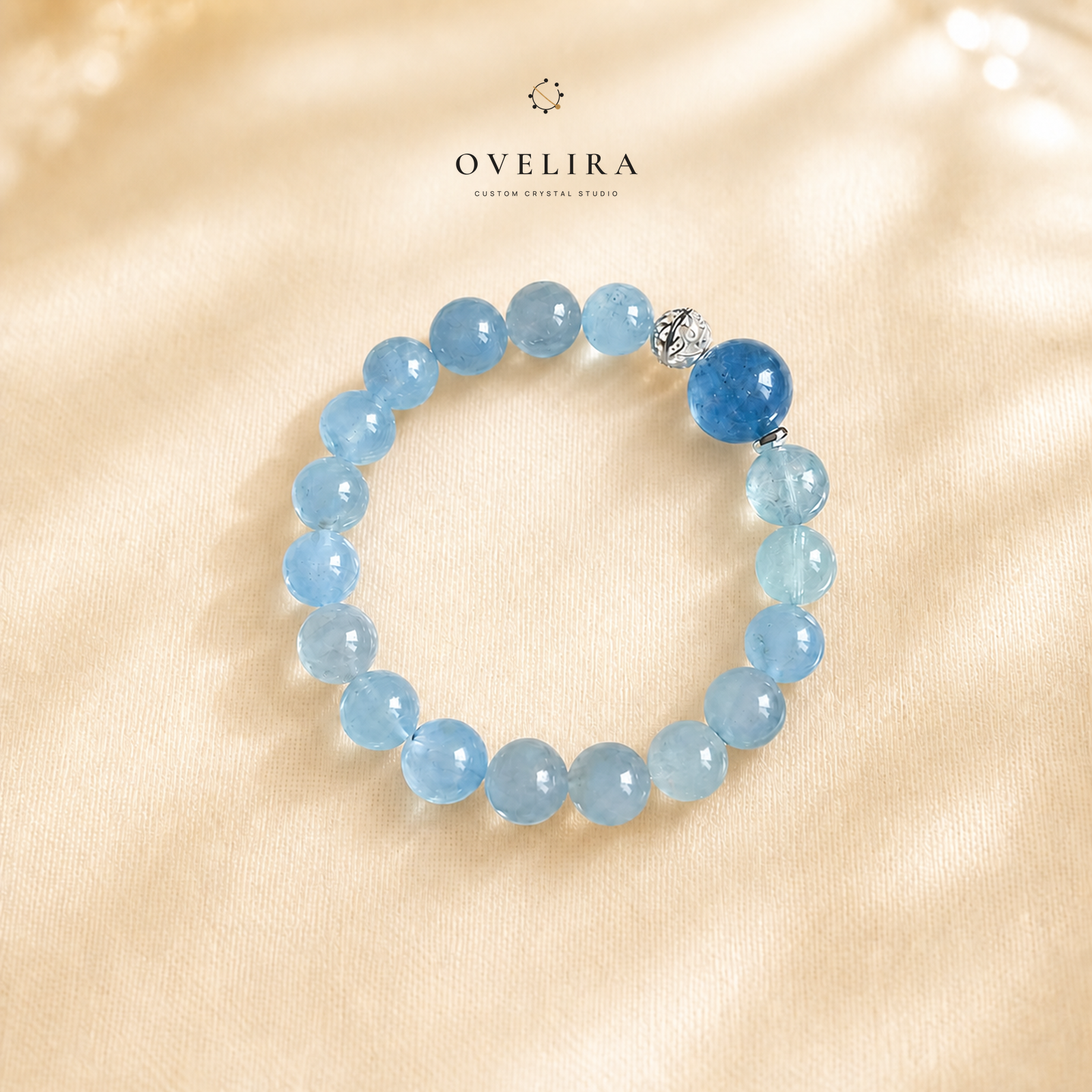 Stillwater Blue aquamarine bracelet on a warm ivory OVELIRA background